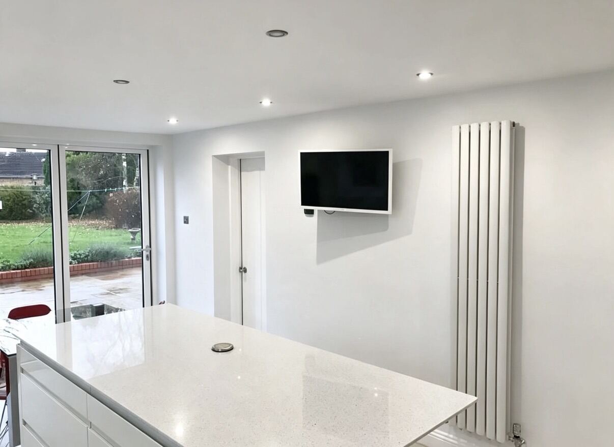 Freshly decorated open-plan kitchen by JMS Decorating Limited