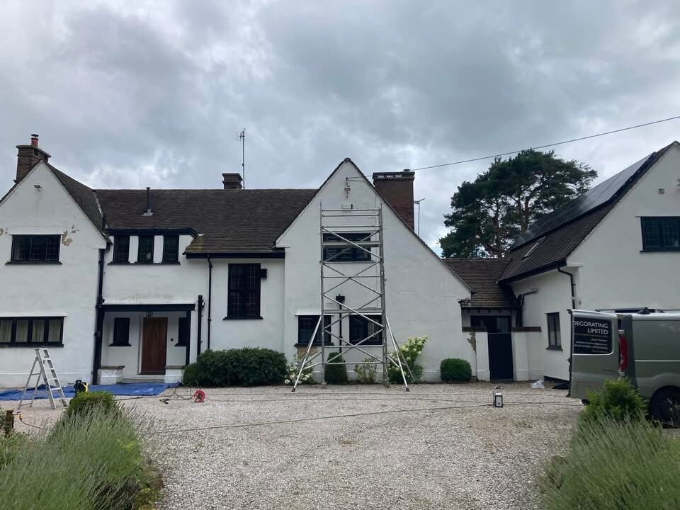 House exterior after a full repaint, crisp white finish