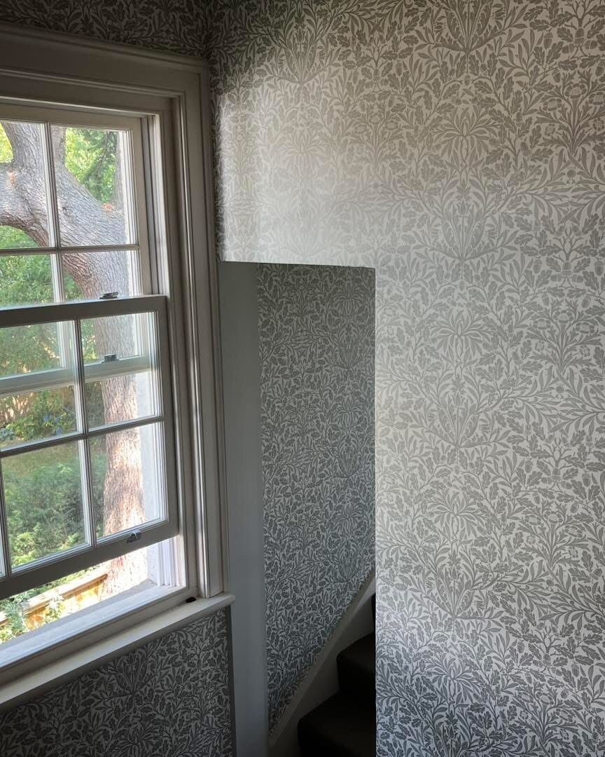 Bright room with patterned wallpaper feature wall