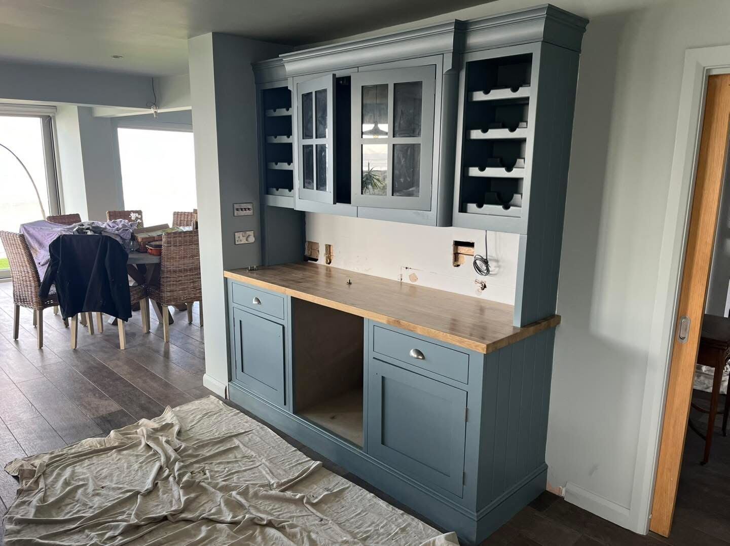 Freshly decorated dining room with fitted cabinetry