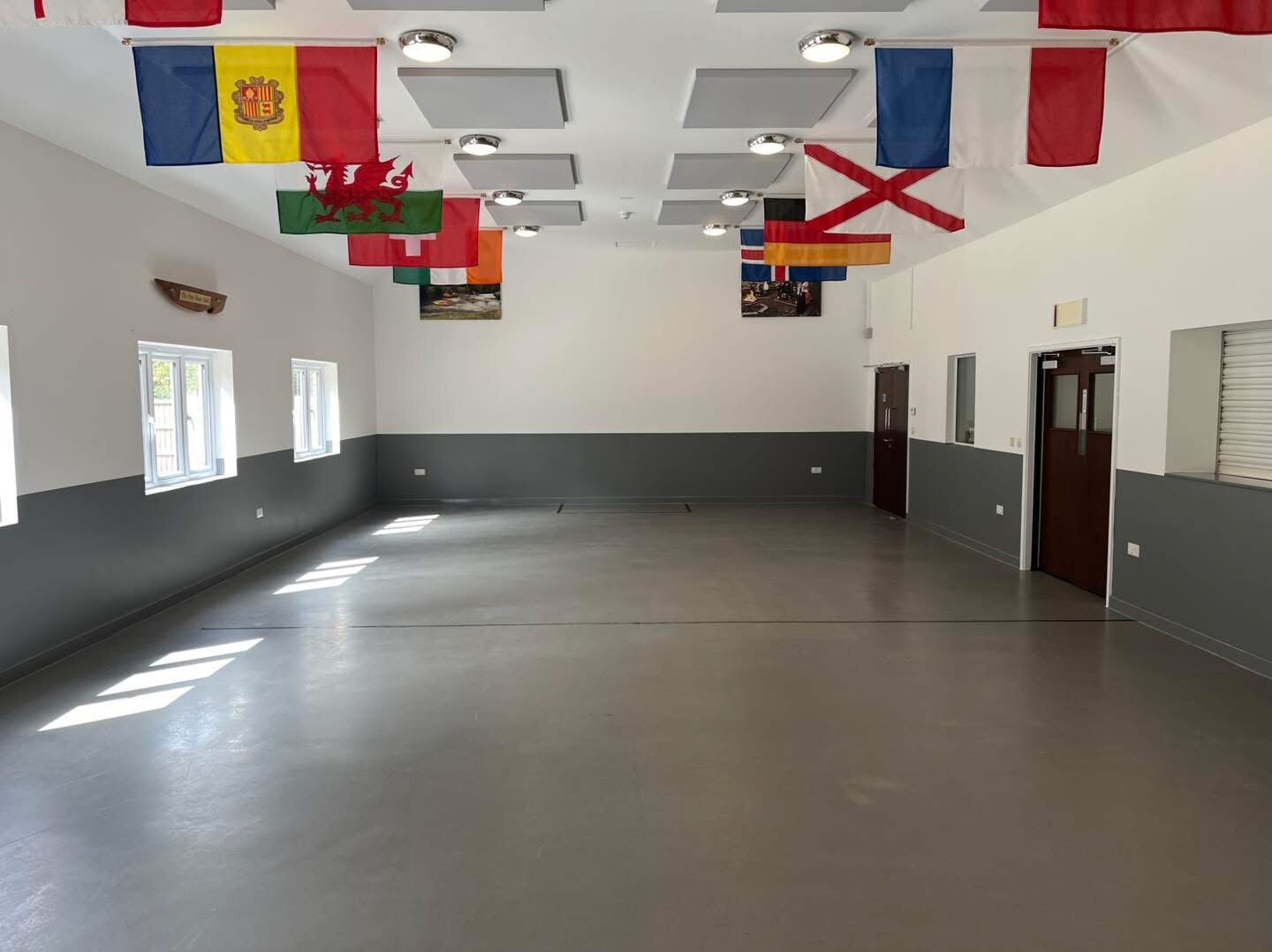 Function hall with international flags, freshly painted