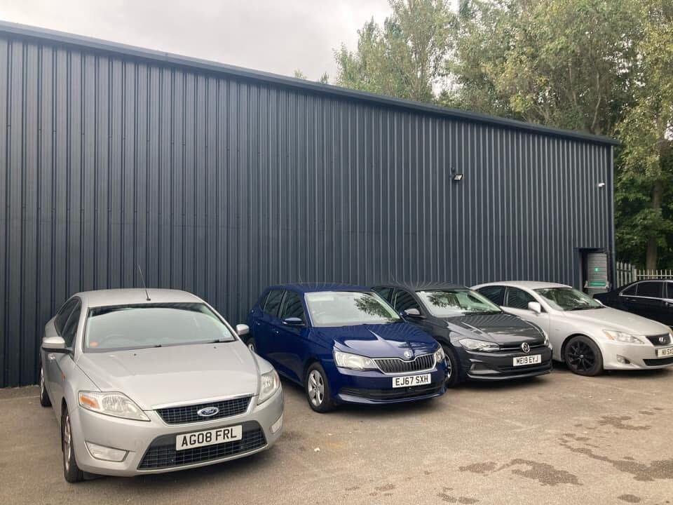 Industrial unit cladding after spray coating, dark charcoal finish