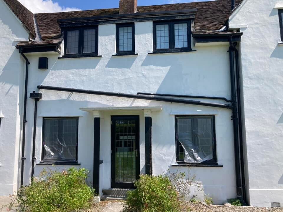 Large house exterior repaint in progress