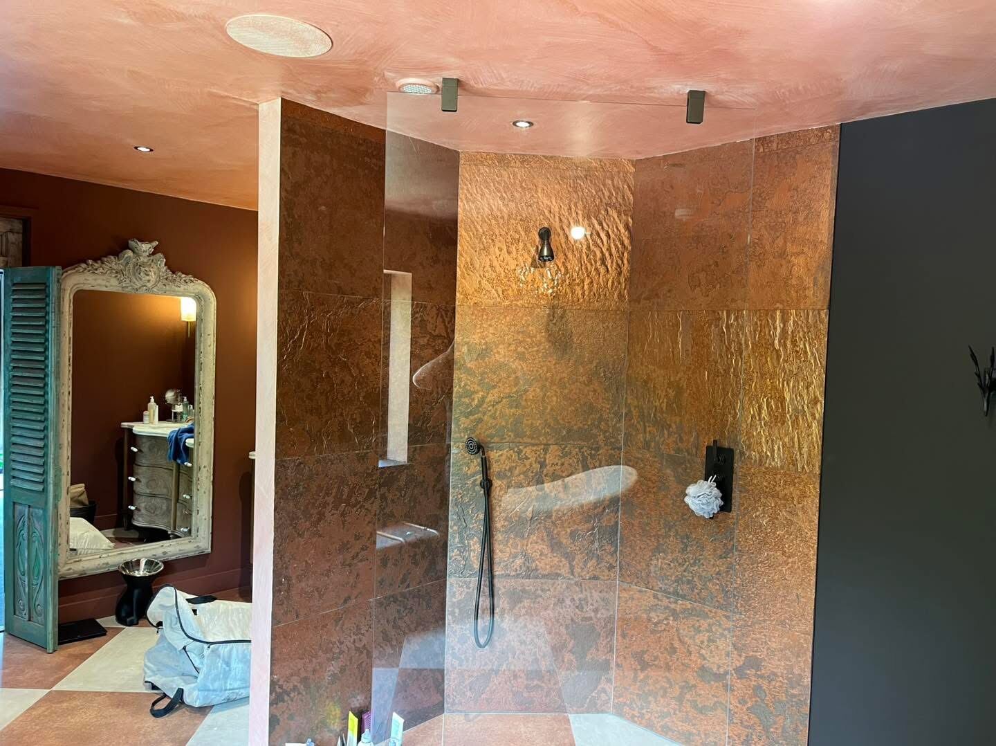 Bathroom with metallic copper feature wall