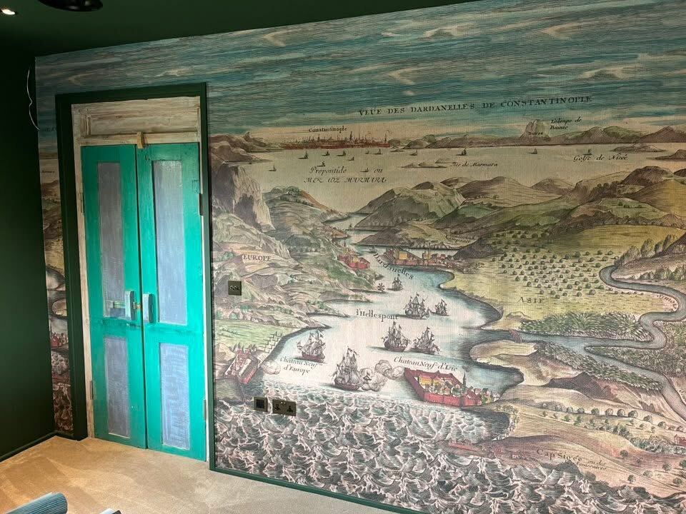 Mural feature wall detail with ornate door