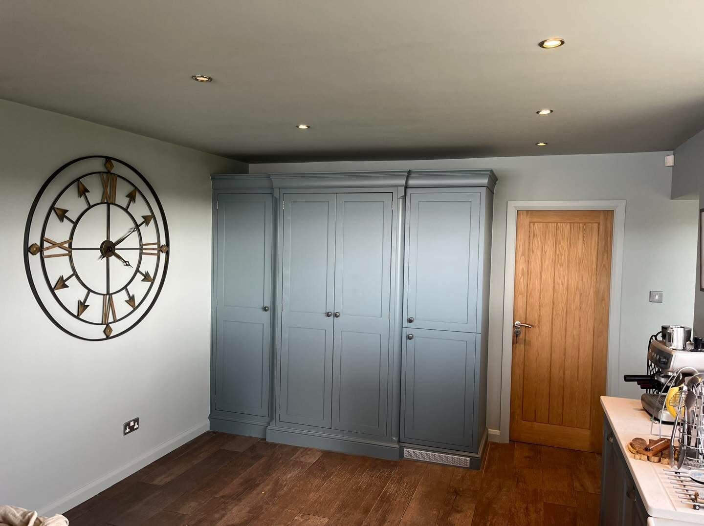 Living room with dark feature door, freshly painted