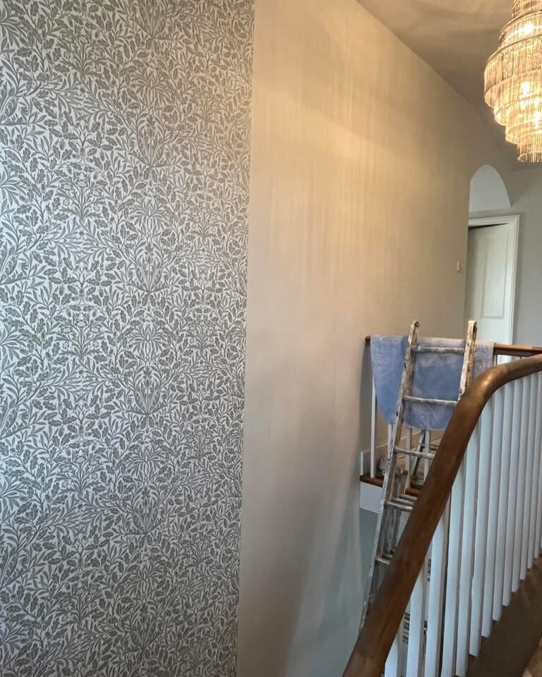 Patterned wallpaper staircase and hallway